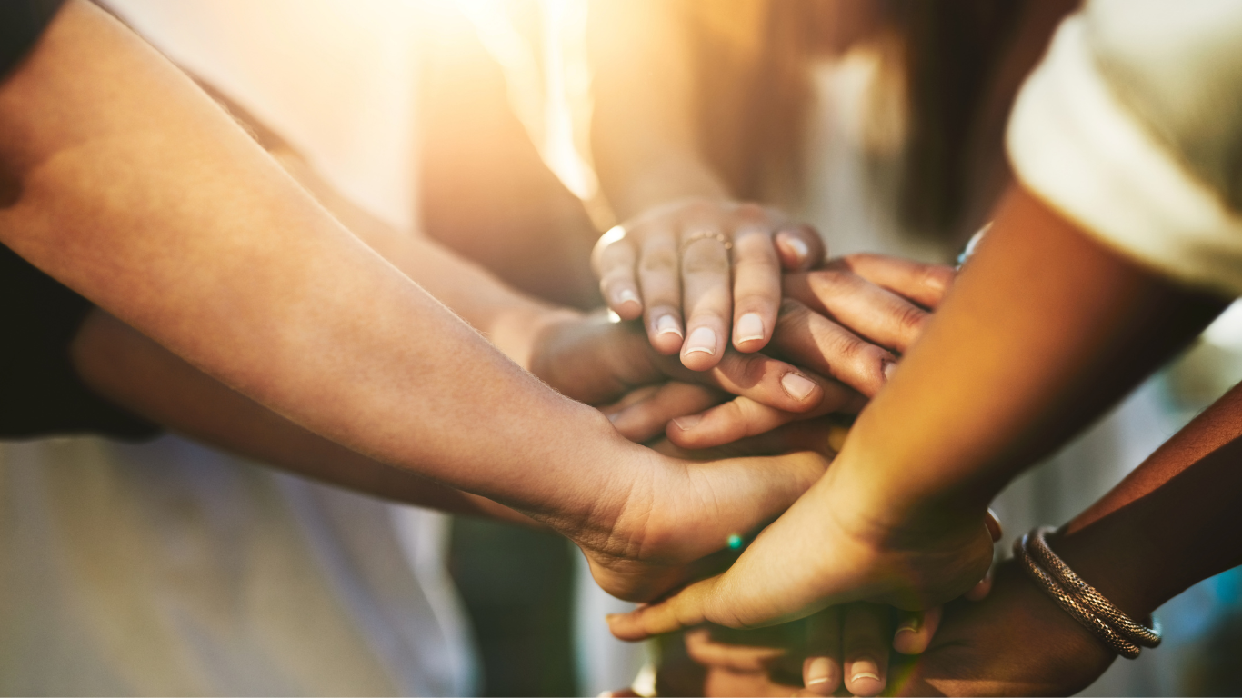 Hands coming together in support