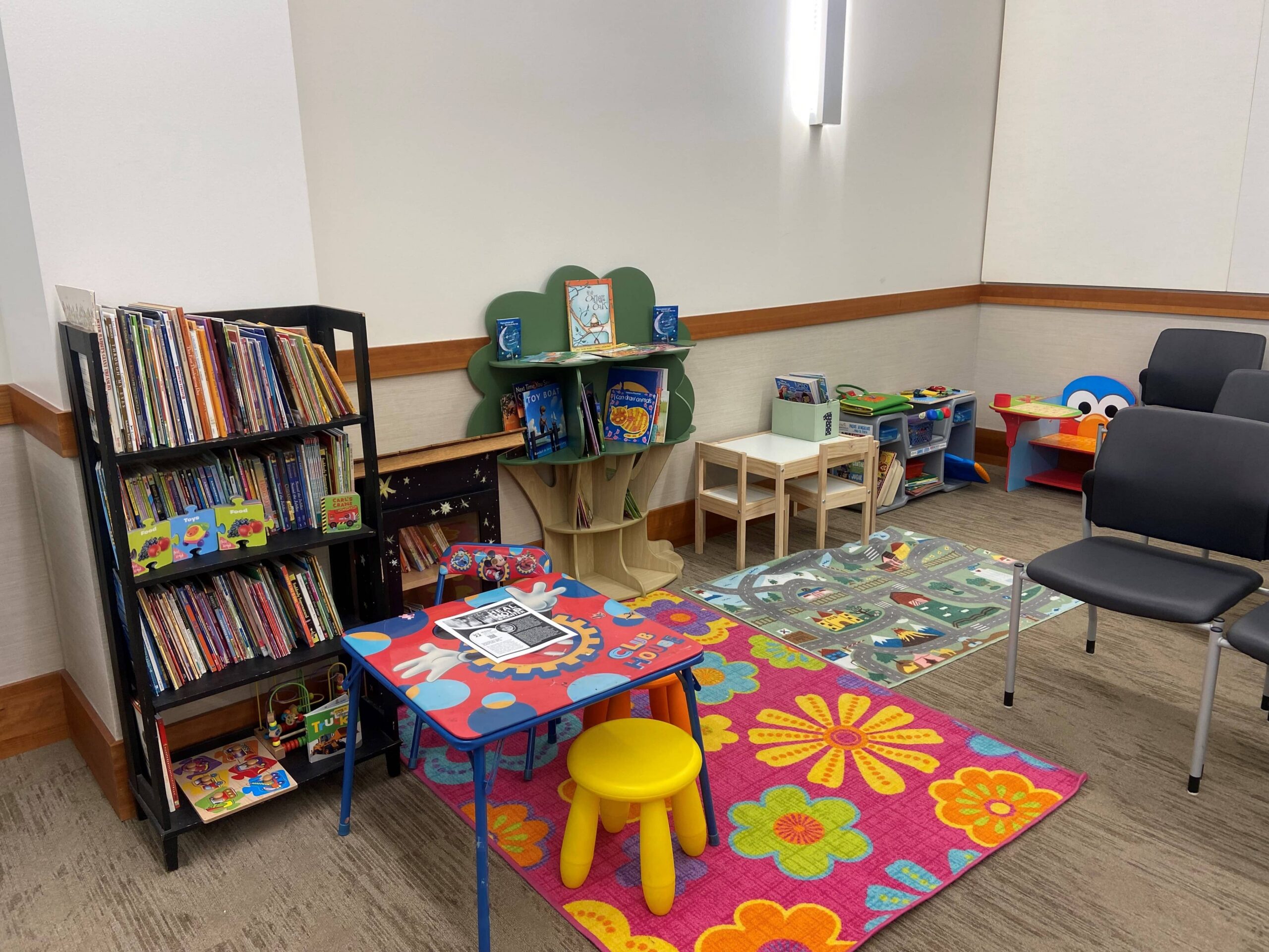 Children's Acorner reading corner with a play rug and tree bookshelf